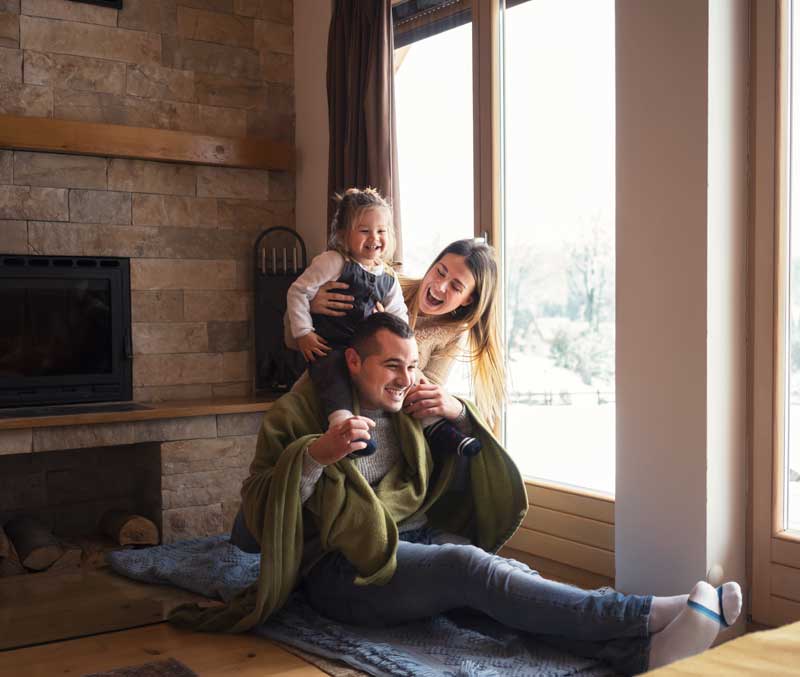 Family warm and happy in the winter in their home